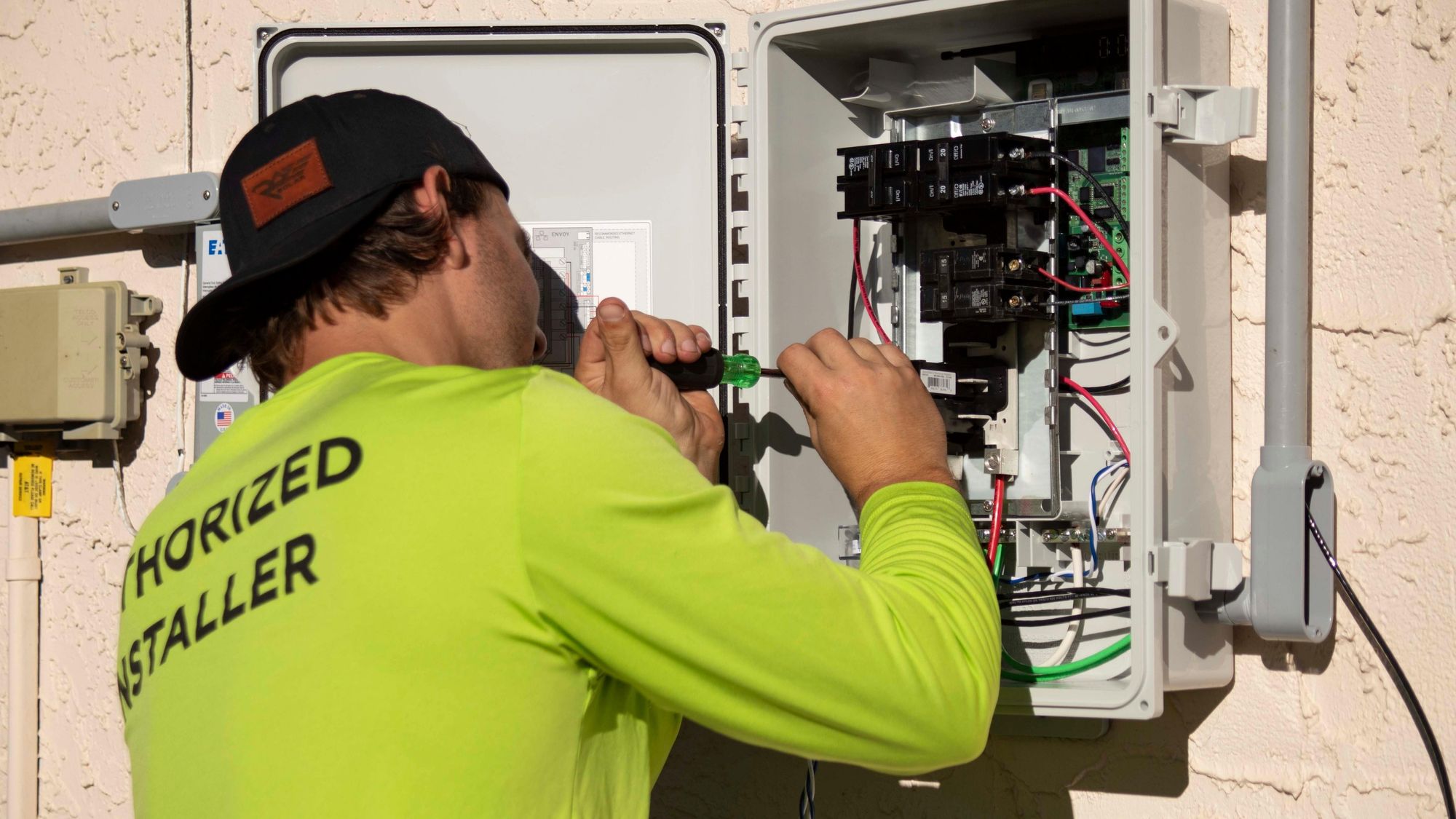 Person installing electrical charger. 