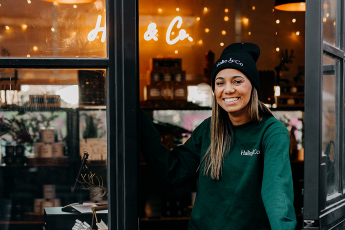 Halie in front of her shop at the midtown markets in Detroit.