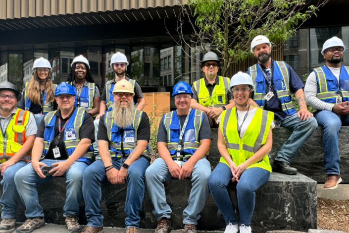 Picture of group of team members in front of the Hudson's Detroit site