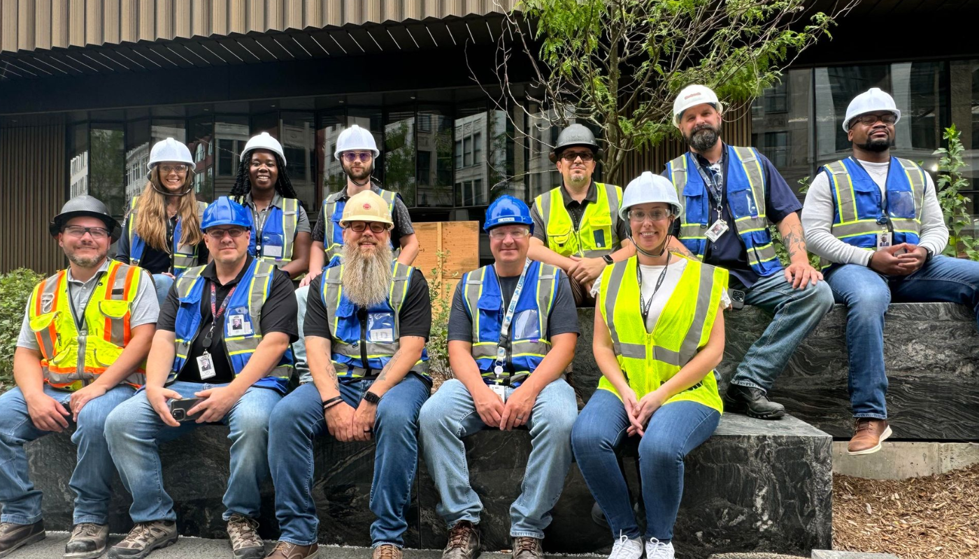 Picture of group of team members in front of the Hudson's Detroit site